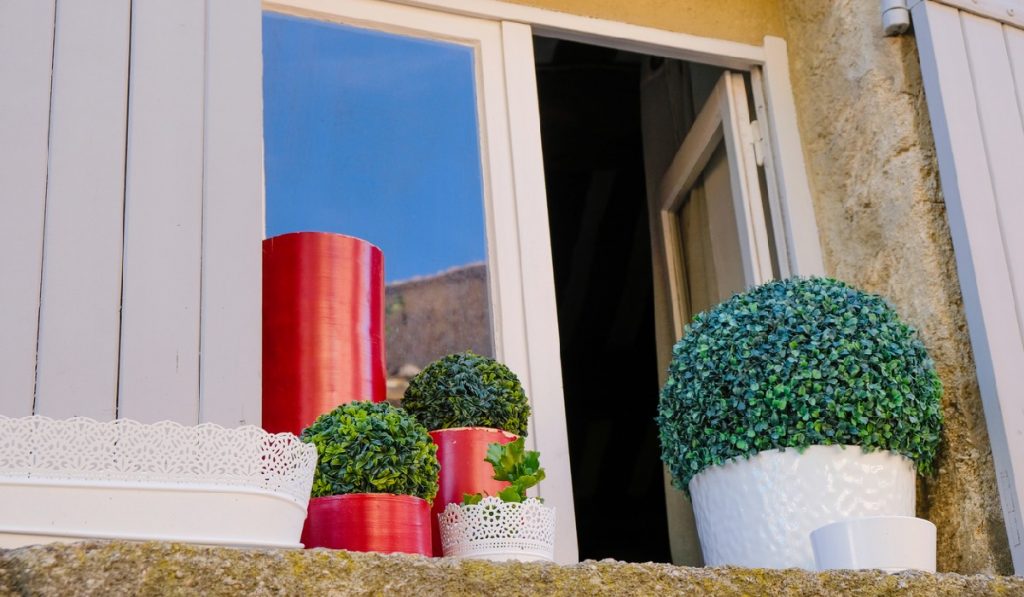 outdoor artificial plants garden-gate Keep Your Artificial Plants Looking Polished With This Cleaning Guide
