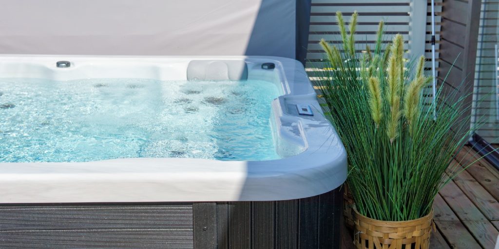 backyard-hot-tub-ideas garden-gate Luxurious hot tub on the backyard terrace.