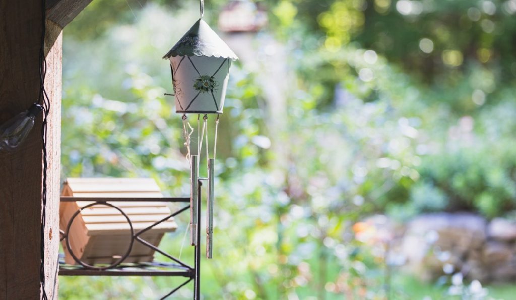 good-luck-garden garden-gate Decorative Wind Chime hanging at the backyard entrance