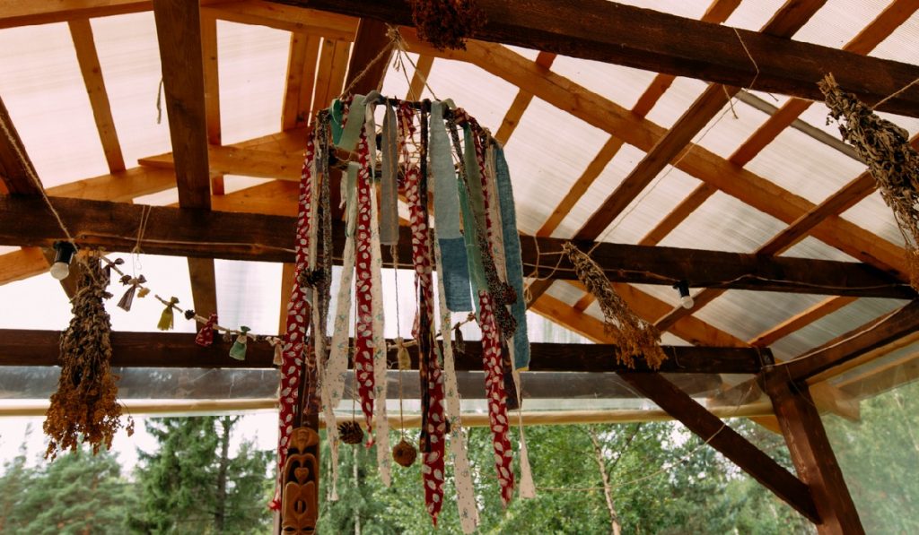 Wind chime hanging in forest