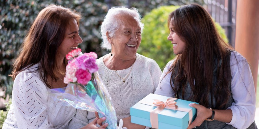 Three generations portrait celebrating mother's day all smiling very happy