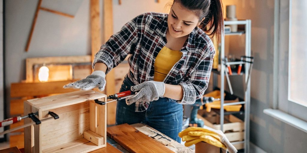 Woman clench wood to make basket