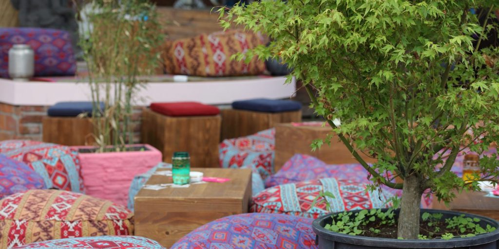 Boho, Bohemian style furniture, colorful poufs. Restaurant garden decor ideas