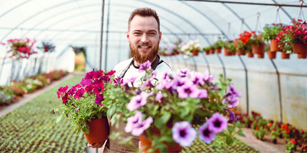 Smiling Gardener Gifting Flowers