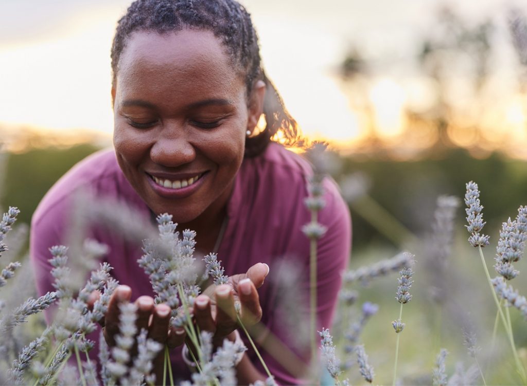 Woman smelling fresh lavender