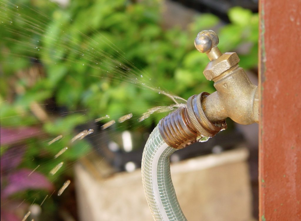 iStock-172674242 Leaky garden hose